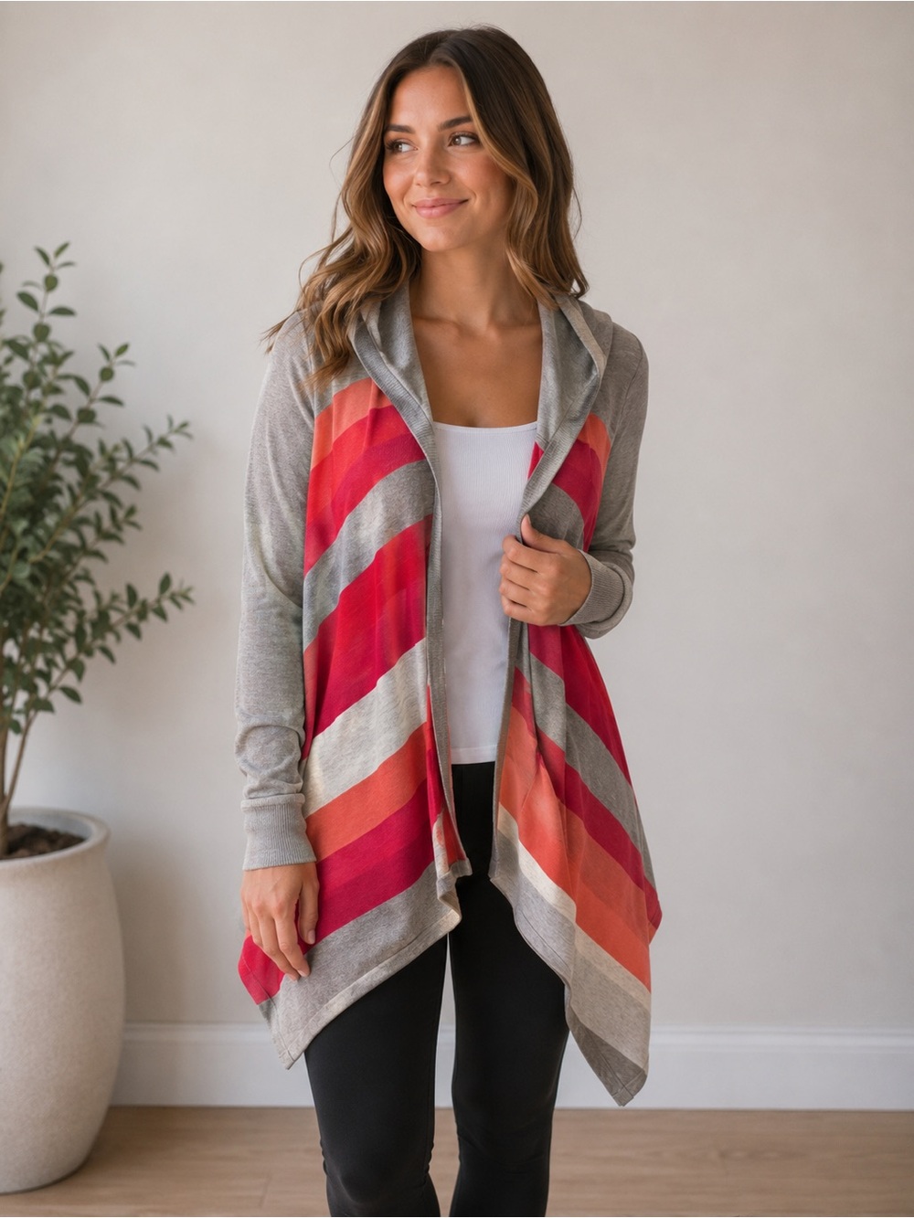 Women’s size small wrap sweater with hood. Brand new with tags.